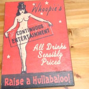 Wood sign with hook in back.